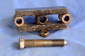 The puller yoke and pressure bolt.